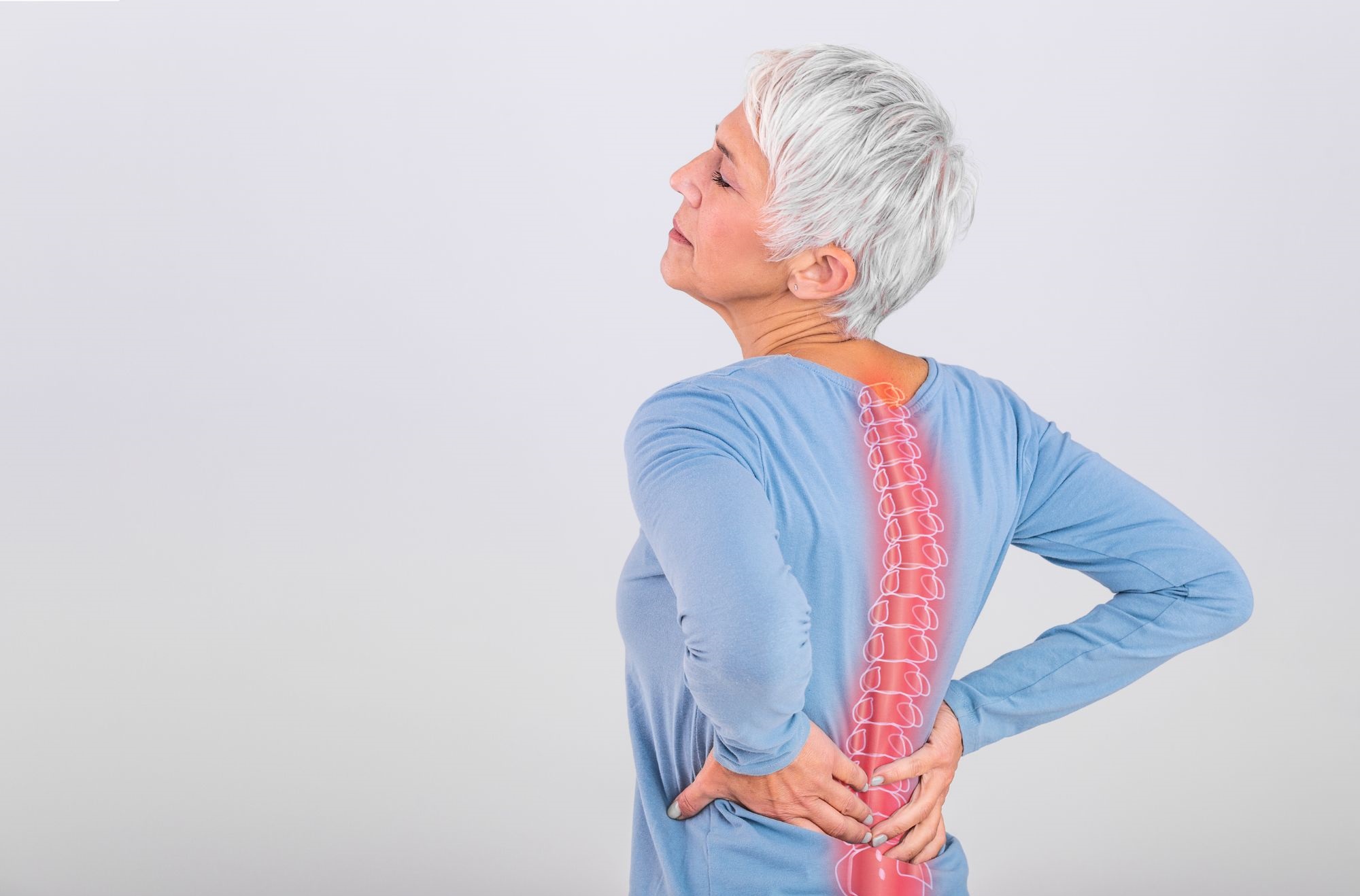 A woman suffering from back pain.